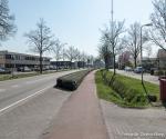 Rondweg, water loopt over fietspad naar de sloot